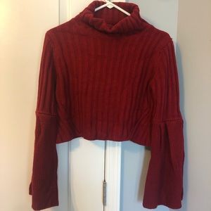 Cropped red knit sweater with flare sleeves
